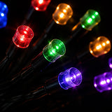 String lights with multicolored bulbs on a dark background