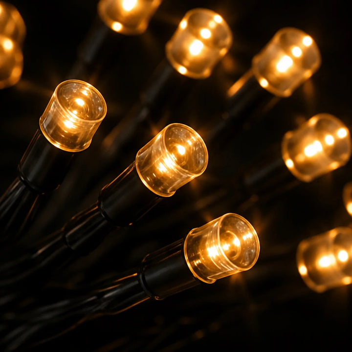 String of illuminated lights on a dark background