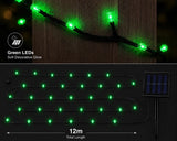 Green LED string lights on a branch with solar panel and length measurement.