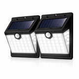 Two solar powered outdoor lights with motion sensor on a white background