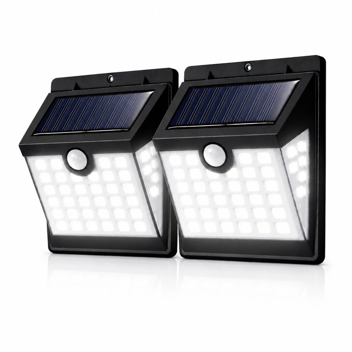 Two solar powered outdoor lights with motion sensor on a white background