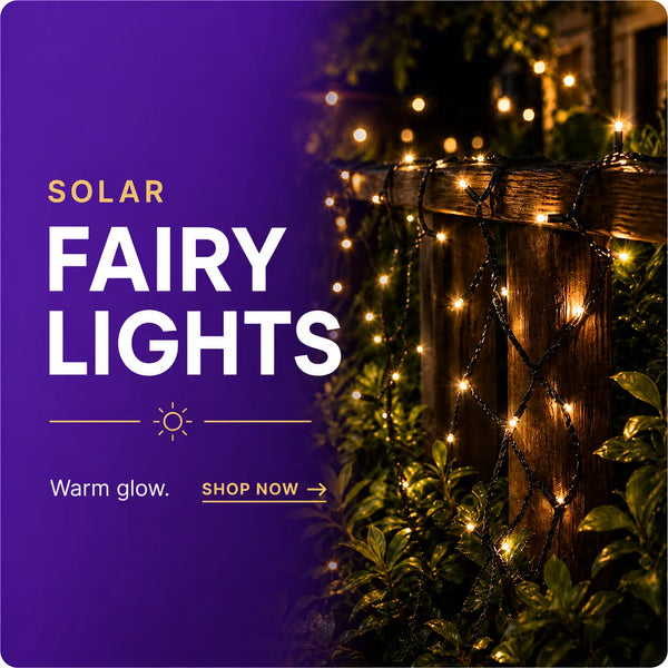 Promotional graphic for solar fairy lights, with a purple text panel on the left reading 'SOLAR FAIRY LIGHTS' and 'Warm glow. SHOP NOW' alongside a photo of warm white string lights draped over a wooden fence and green plants at night.