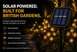 Solar powered garden light with text highlighting features, set against a garden backdrop.